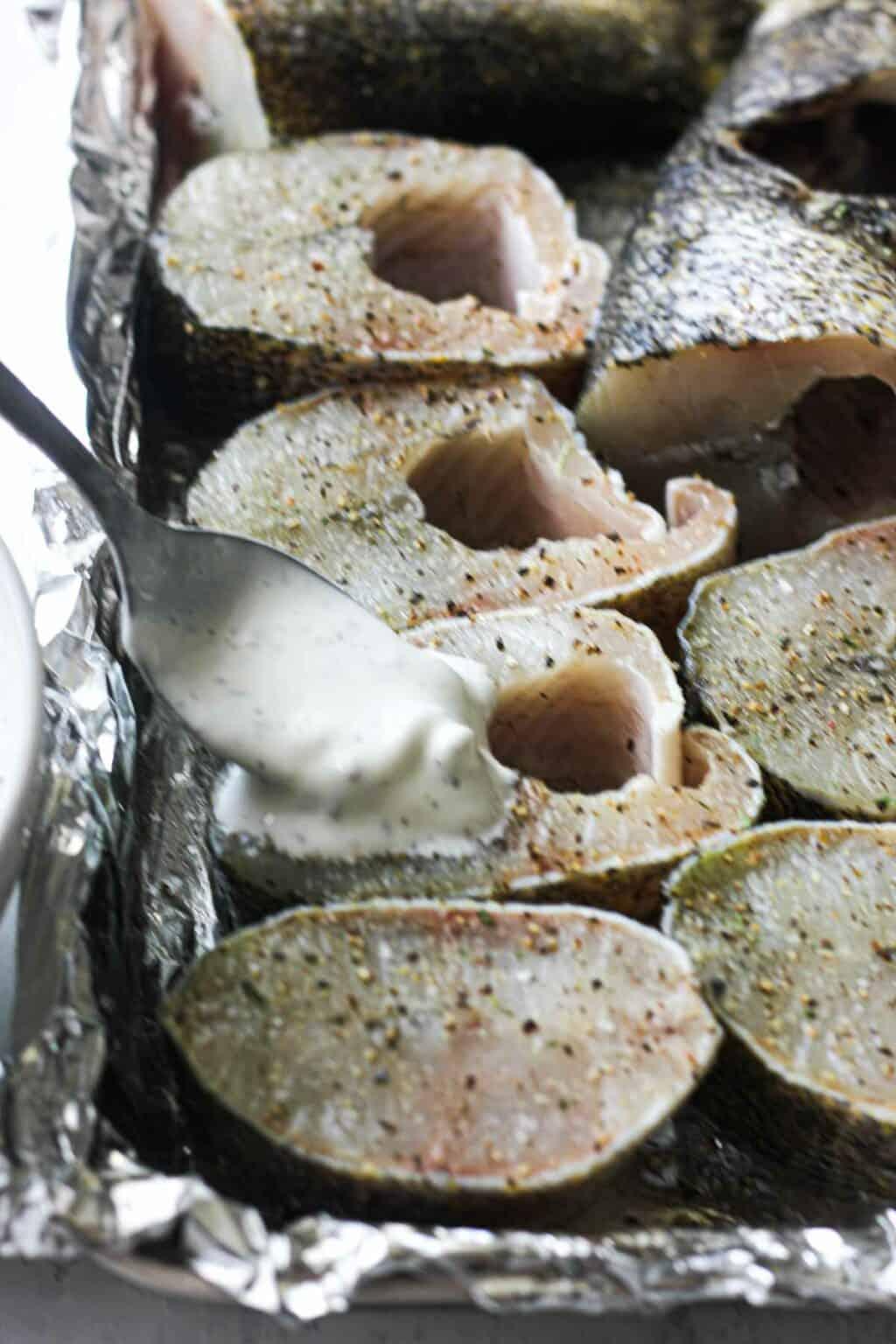 Pike steaks being prepared in a roasting pan